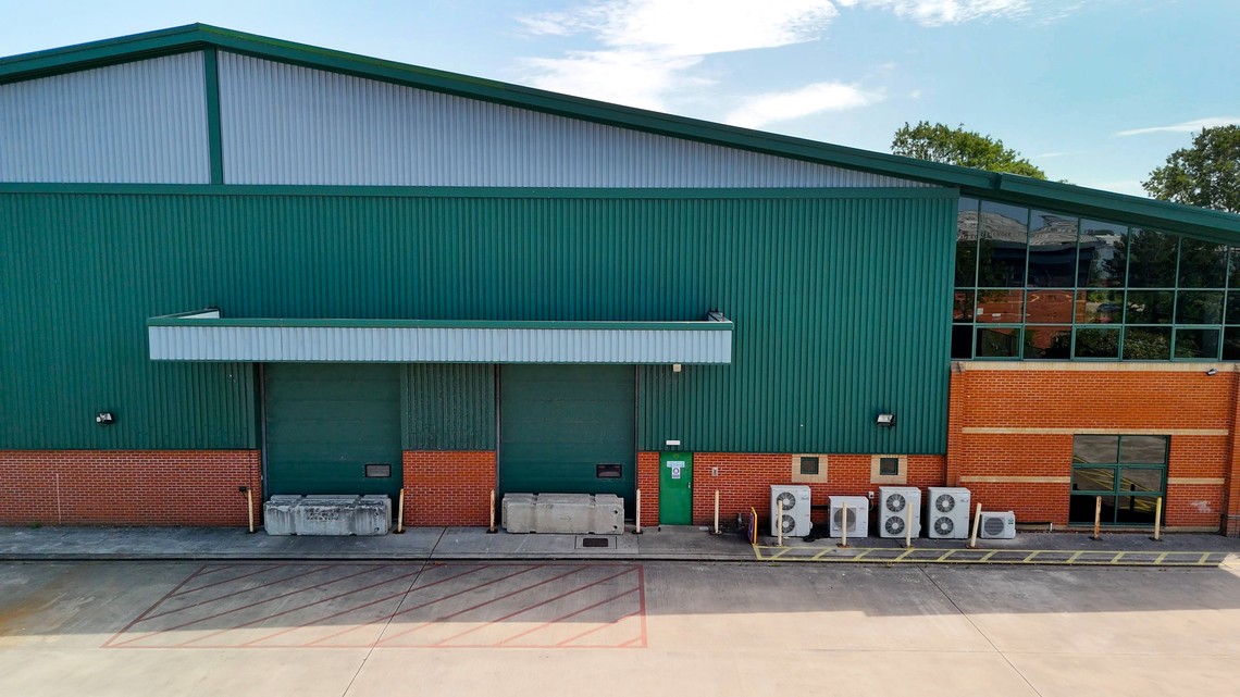 The two surface level loading doors beneath the canopy on the south elevation