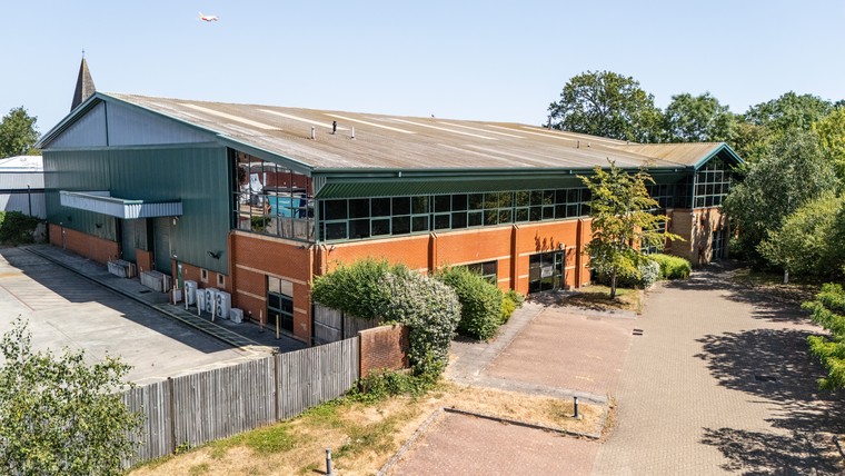 Aerial view of South Corner and its yard from the south